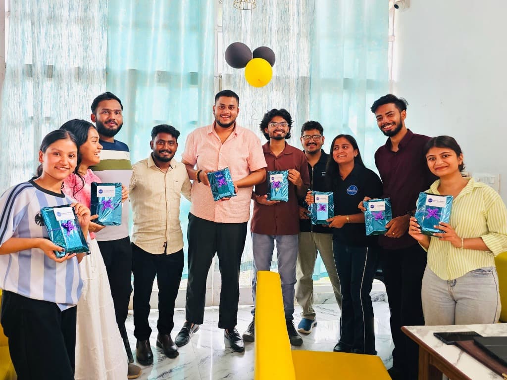 GharPadharo team celebrating together with gifts